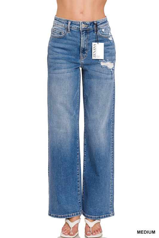 High weighted Blue jeans with a little distressing, a tag on a white background