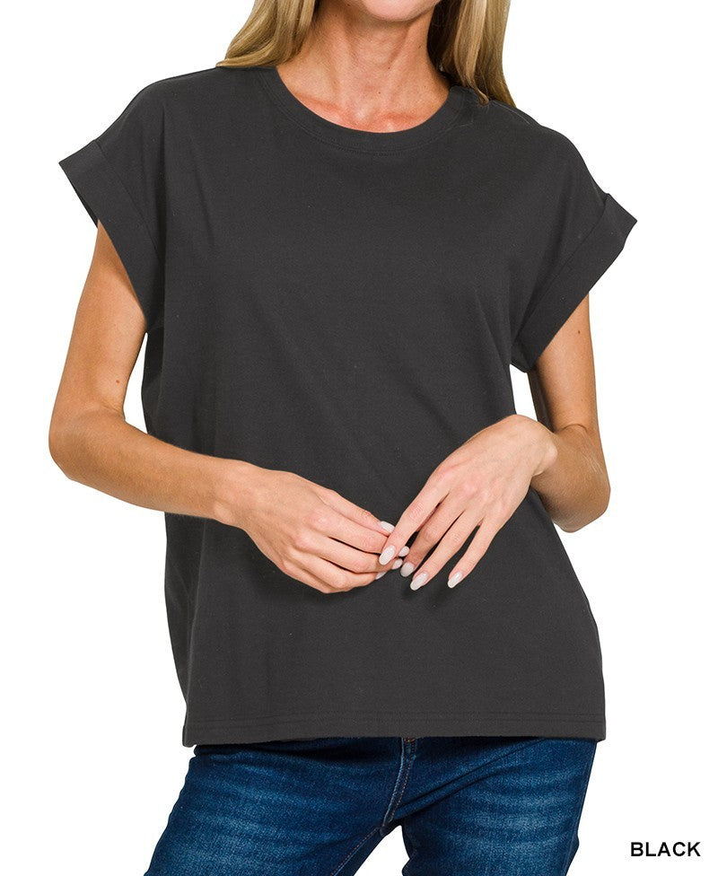 Person wearing a black t-shirt with cuff sleeve on a white background