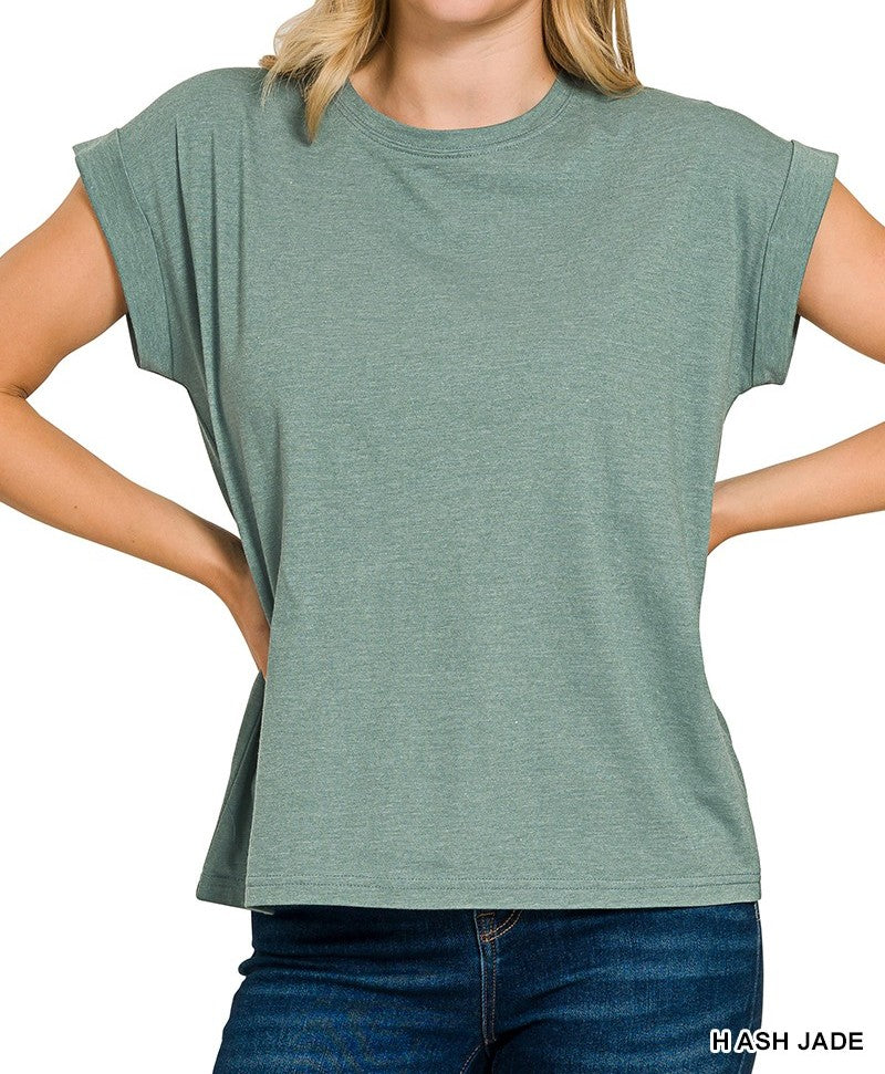 Person wearing a jade green t-shirt with cuffed sleeve on a white background