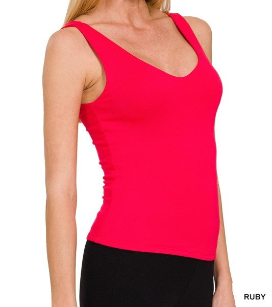 Red tank top worn by a person on a white background
