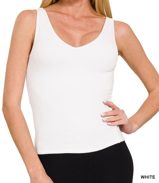 White tank top worn by a person on a white background